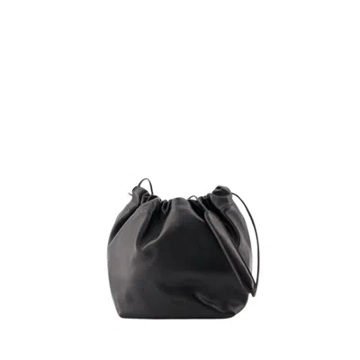 Jil Sander Logo Embossed Drawstring Medium Shoulder Bag In Black