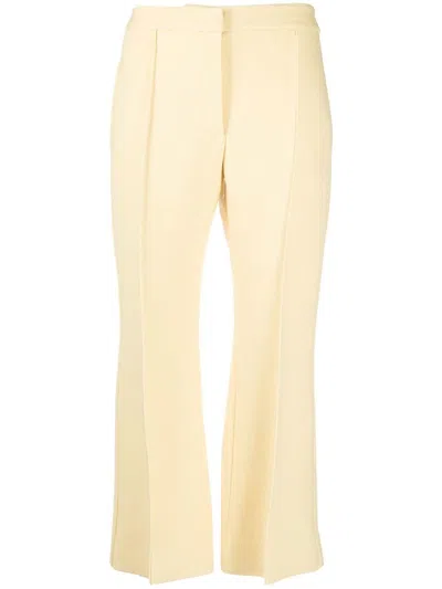 Jil Sander Flared Virgin-wool Cropped Trousers In Yellow