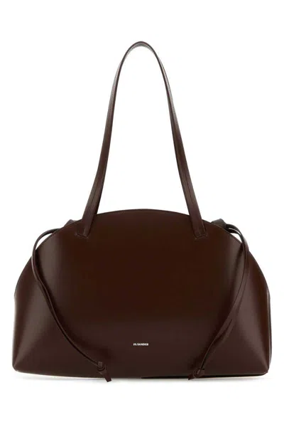 Jil Sander Handbags. In Brown