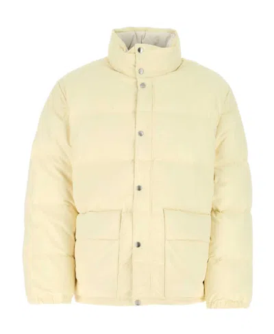 Jil Sander High Neck Long-sleeved Quilted Jacket In Brown