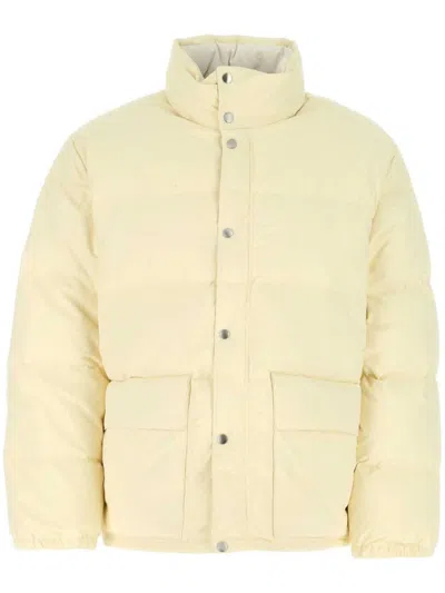 Jil Sander High Neck Long-sleeved Quilted Jacket In Brown