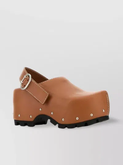 JIL SANDER LEATHER CLOGS WITH CHUNKY SOLE AND STUDDED EMBELLISHMENTS