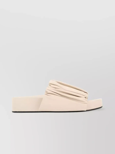 JIL SANDER LEATHER SLIDES WITH RUCHED DETAILING AND FLAT SOLE