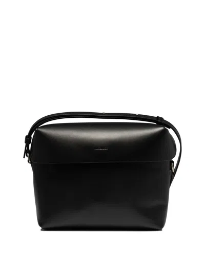 Jil Sander Logo-embossed Crossbody Bag In Black