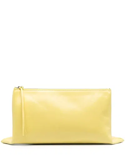 Jil Sander Logo-debossed Clutch Bag In Gelb