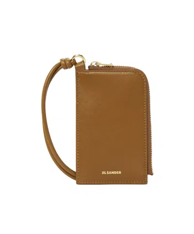 Jil Sander Logo Embossed Zipped Cardholder In Brown