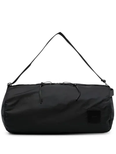 Jil Sander Logo-patch Circular Duffle Bag In Black