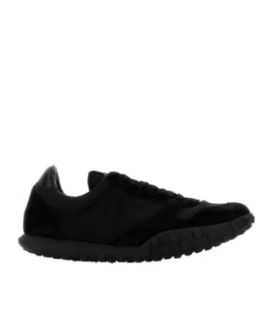 JIL SANDER JIL SANDER LOGO EMBOSSED LOW-TOP SNEAKERS