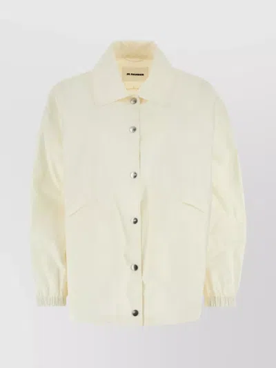 JIL SANDER LOGO-PRINTED DRAWSTRING WINDBREAKER