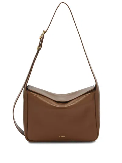 Jil Sander Logo-stamp Leather Crossbody Bag In Brown