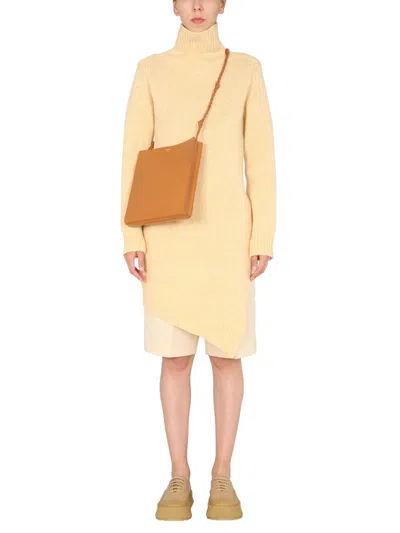 Jil Sander Long Asymmetric Wool Sweater In Yellow