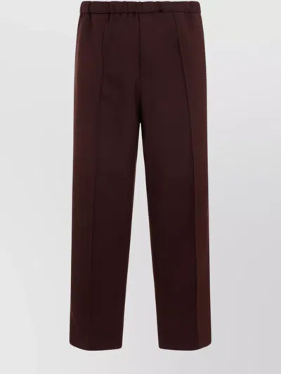JIL SANDER POLYESTER TROUSERS WITH FLAP POCKETS AND FRONT CREASES