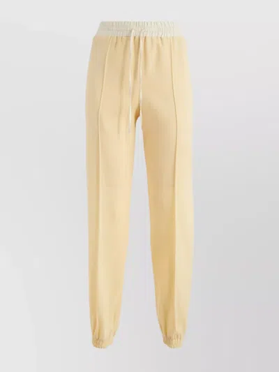 Jil Sander Trousers With Elastic Waistband And Tapered Leg In Yellow