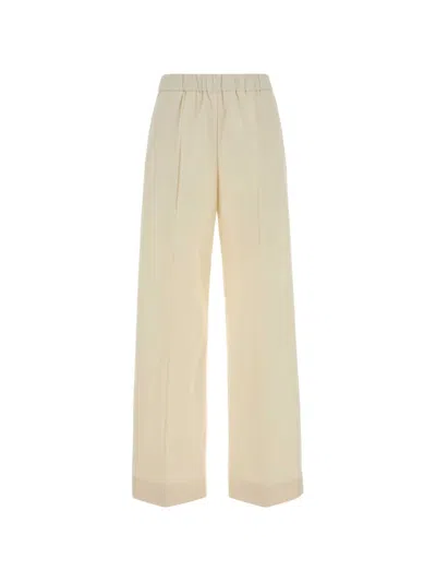 Jil Sander Cotton Pleated Wide Leg Cuffed Trousers In Yellow