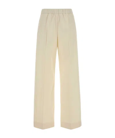 Jil Sander Cotton Pleated Wide Leg Cuffed Trousers In Yellow
