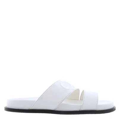 Jimmy Choo Embossed Logo Leather Slides In Animal Print