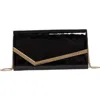 Jimmy Choo Emmie Small Asymmetrical Clutch Bag In Black/light Gold