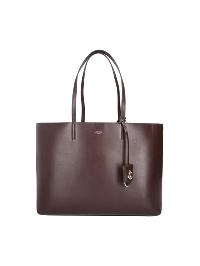 Jimmy Choo -style Pocket-chic Clutch Bag In Calf Leather With Brass Detail In Brown
