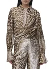 Simkhai Luella Long Sleeve Deep V Top In Gold In Gold