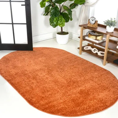 Jonathan Y Haze Solid Low-pile Oval Area Rug In Coral-orange