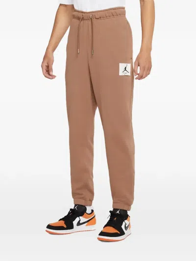 Jordan Essential Statement Fleece Track Pants In Brown