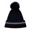 Judson & Company Women's Stripe Details Knit Beanie With Faux Fur Pom Pom In Preppy Black In Black