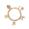 Juicy Couture Charm Bracelet With Bow And Pave Details In Gold