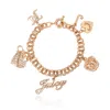 Juicy Couture Charm Bracelet With Pave Accents In Gold