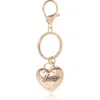 Juicy Couture Gold Heart Keychain With Pearls In Gold