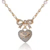 Juicy Couture Gold-tone Pearl Heart Pendant Necklace In Gold
