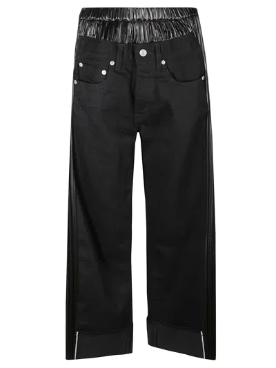 JUNYA WATANABE DENIM AND FAUX LEATHER JEANS