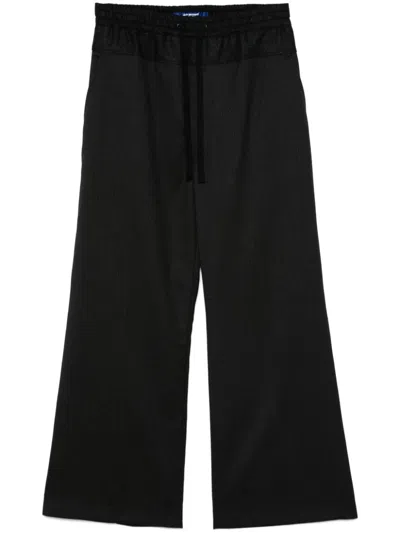 JUNYA WATANABE PINSTRIPED TROUSERS