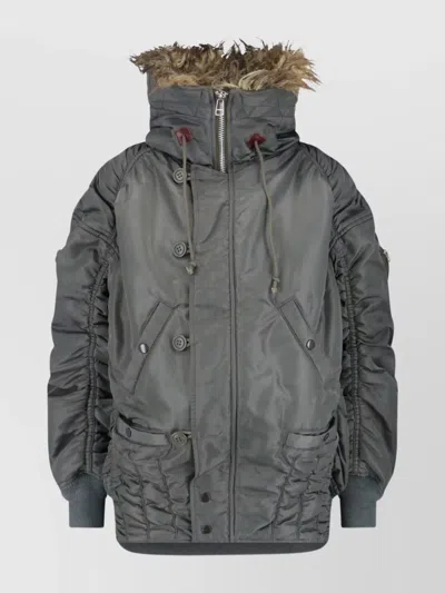 JUNYA WATANABE QUILTED JACKET WITH DRAWSTRING HOOD AND FUR TRIM
