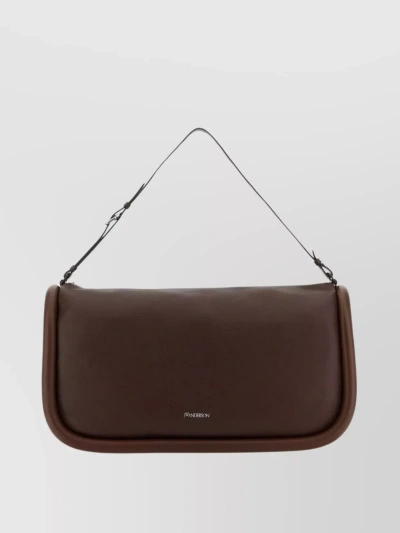 Jw Anderson Adjustable Strap Leather Travel Bag In Brown