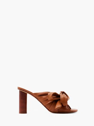 Jw Anderson Bow Heeled Mules In Brown
