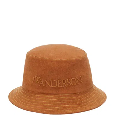 Jw Anderson Logo-embossed Cotton Bucket Hat In Brown