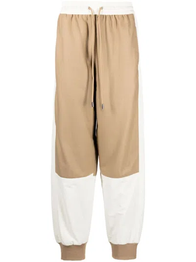 JW ANDERSON COLOUR-BLOCK TAPERED TRACK PANTS