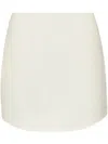Jw Anderson Ivory Curved Hem Miniskirt In White
