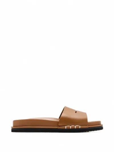Jw Anderson Fussbett Leather Slides In Brown