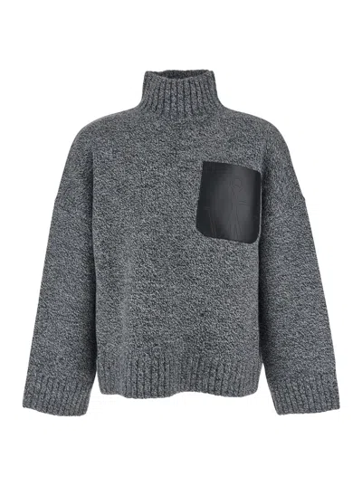 JW ANDERSON GREY SWEATER WITH HIGH NECK AND ONE FRONT PATCH LEATHER POCKET IN WOOL BLEND MAN