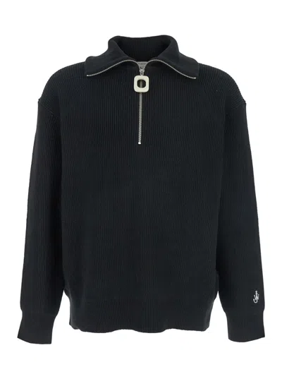 JW ANDERSON BLACK BLEND HIGH NECK SWEATER WITH EMBROIDERED LOGO ON THE SLEEVE IN COTTON MAN