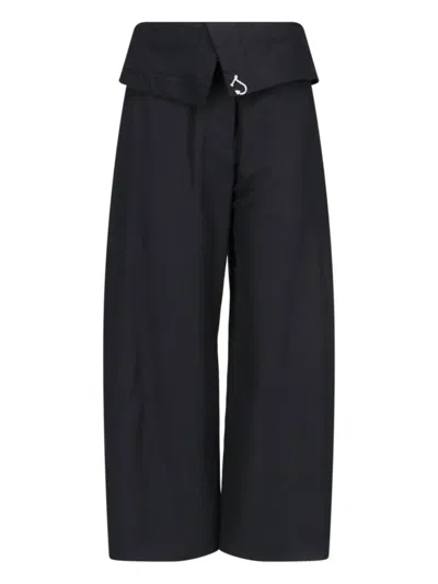 JW ANDERSON HIGH-WAISTED BLACK WIDE-LEG PANTS WITH SILVER LOGO DETAIL