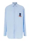 Jw Anderson Light Blue Shirt With Classic Collar And Embroidery Detail On Front And Cuff In Light Blue