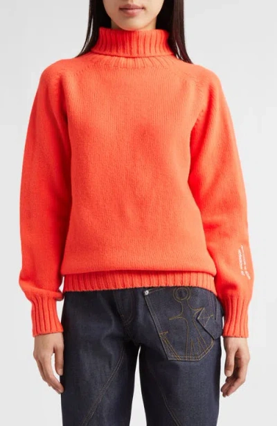 Jw Anderson Logo Embroidered Wool Turtleneck Sweater In Orange