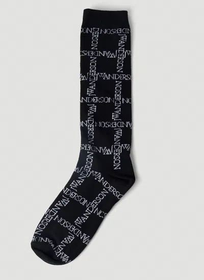 Jw Anderson Logo Grid Long Socks In Black