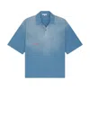 Jw Anderson Oversized Logo Embroidered Polo Shirt In Light Blue
