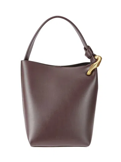JW ANDERSON SLEEK BUCKET BAG WITH MAGNETIC CLOSURE