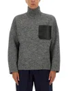 Jw Anderson Grey Sweater With High Neck And One Front Patch Leather Pocket In Wool Blend Man In Gray