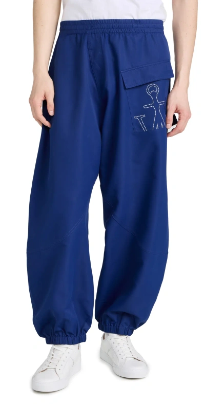 Jw Anderson Oversized Twisted Logo Sweatpants In Blue