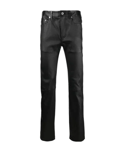 Jw Anderson Wax-coated Mid-rise Trousers In Black